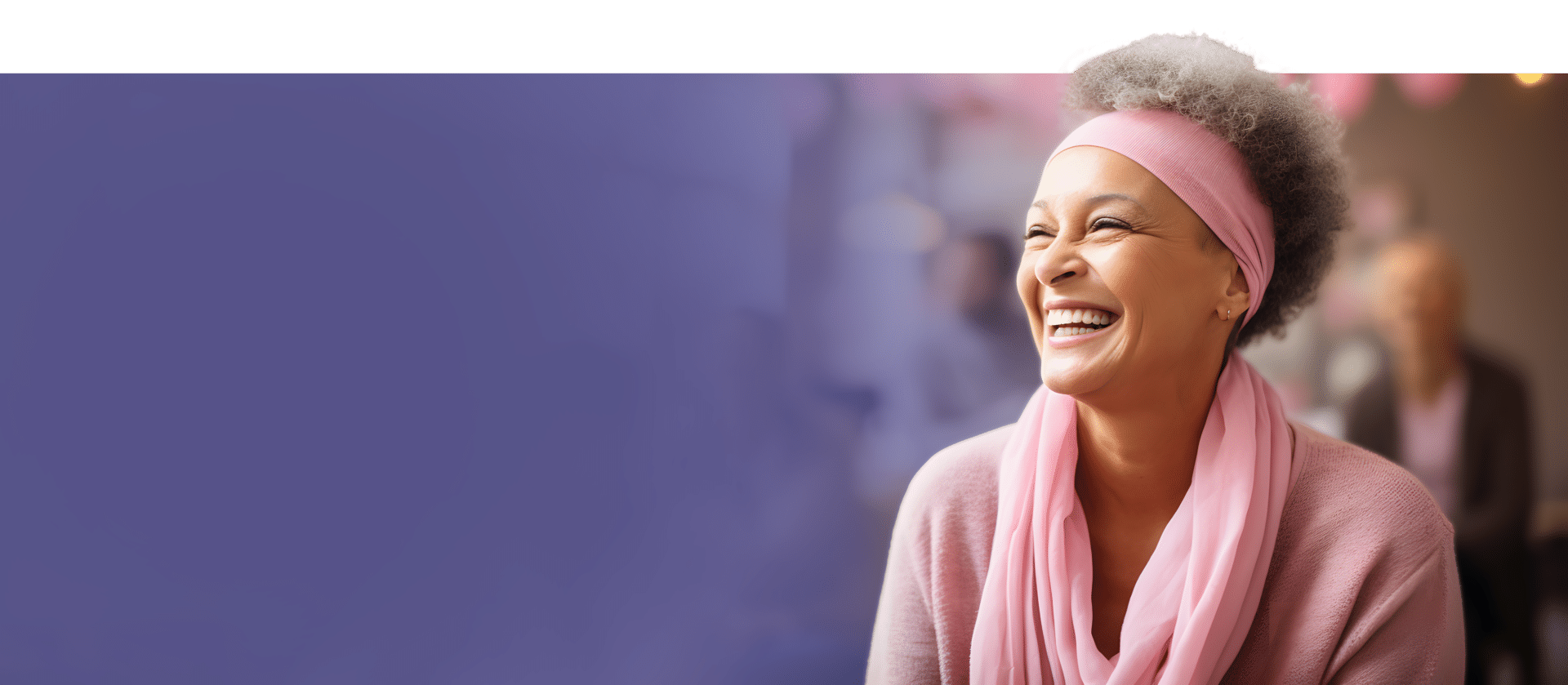 A woman with short gray hair and a pink headband smiles broadly. She wears a matching pink scarf and sweater. The background is a soft purple, fading into a blurred interior scene with lights.